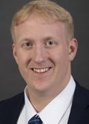 A portrait of Matthew Brummond of the Department of Health Management and Policy at the University of Iowa College of Public Health.