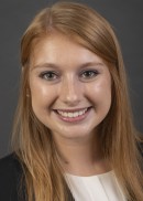 A portrait of Emma McIntire of the Department of Health Management and Policy at the University of Iowa College of Public Health.