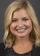 A portrait of Nicole Vershaw of the Department of Health Management and Policy at the University of Iowa College of Public Health.