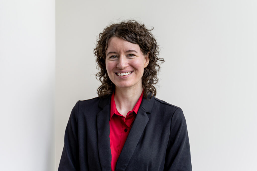 Portrait of Emily Lawton, assistant professor in the Department of Health Management and Policy at the University of Iowa College of Public Health.