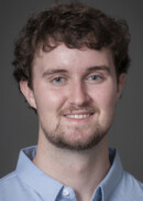 A portrait of Justin Bonds of the Department of Occupational and Environmental Health at the University of Iowa College of Public Health.