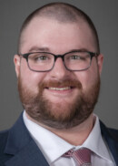 A portrait of Andrew Bullard of the Department of Health Management and Policy at the University of Iowa College of Public Health.