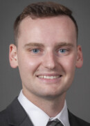 A portrait of Justin Daniel of the Department of Health Management and Policy at the University of Iowa College of Public Health.