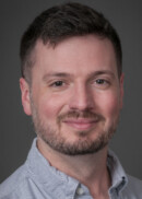 A portrait of Joshua Gautreaux of the Department of Occupational and Environmental Health at the University of Iowa College of Public Health.